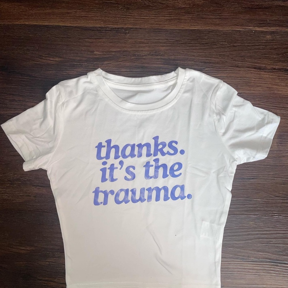 White T-Shirt with thanks. It’s the trauma